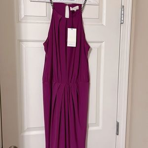 Brand new Prum color dress with tags, size med. Fit right above the knees.